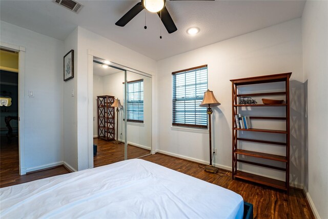 9305 Emnora Ln, Houston, TX 77080 - bedroom with wood finished floors, baseboards, and a closet