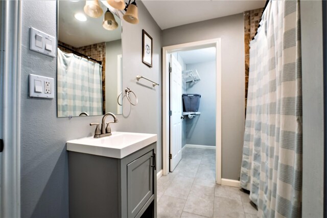 9305 Emnora Ln, Houston, TX 77080 - bathroom with tile patterned flooring, vanity, a shower with curtain, and baseboards