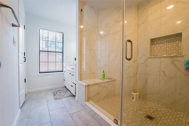 9305 Emnora Ln, Houston, TX 77080 - full bathroom with a stall shower, tile patterned floors, and baseboards