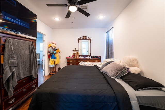 9305 Emnora Ln, Houston, TX 77080 - bedroom with dark wood-style flooring and a ceiling fan