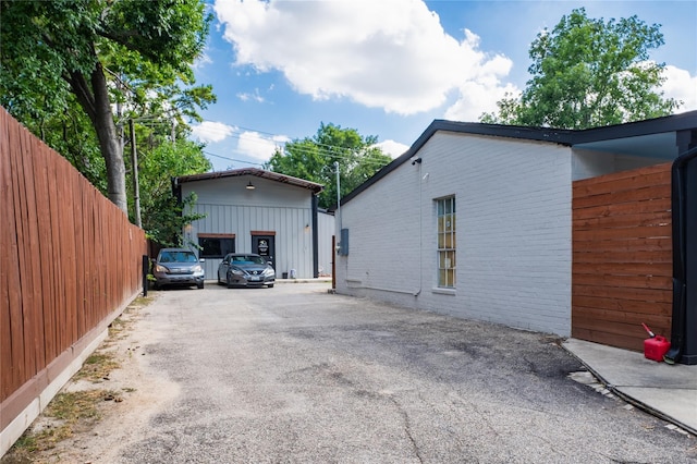 9305 Emnora Ln, Houston, TX 77080 - view of property exterior with asphalt driveway