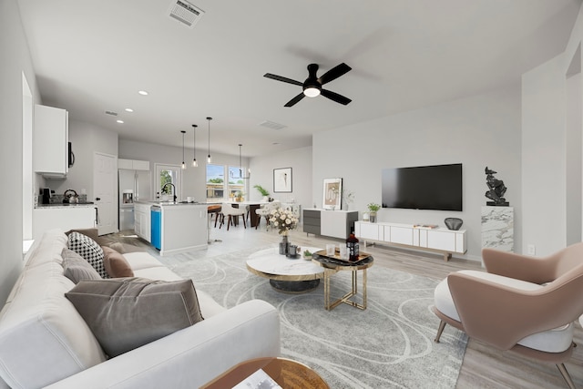 8 Donna Ct, Brookshire, TX 77423 - living room featuring a ceiling fan, light wood-type flooring, and recessed lighting