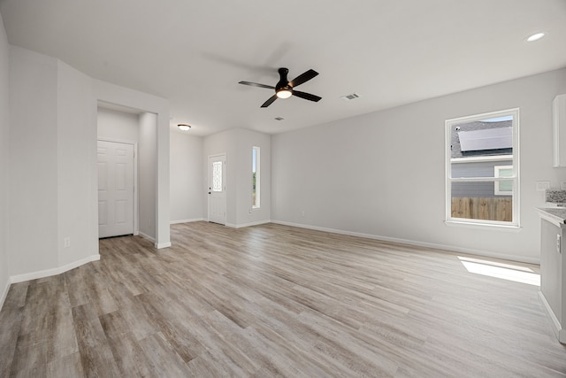8 Donna Ct, Brookshire, TX 77423 - unfurnished living room featuring light wood-style floors, baseboards, ceiling fan, and recessed lighting