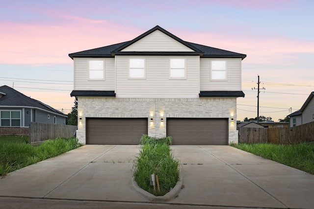 8 Donna Ct, Brookshire, TX 77423 - view of front facade featuring concrete driveway, an attached garage, and stone siding