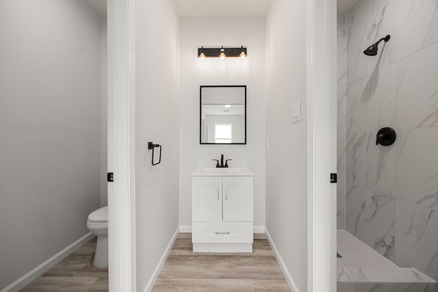 8 Donna Ct, Brookshire, TX 77423 - bathroom featuring a marble finish shower, toilet, vanity, and wood finished floors