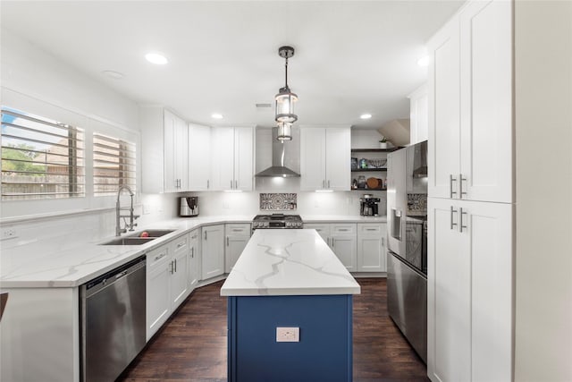 6923 Cobblestone Path, Houston, TX 77084 - kitchen with appliances with stainless steel finishes, a sink, wall chimney range hood, a center island, and open shelves