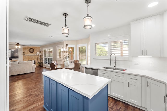 6923 Cobblestone Path, Houston, TX 77084 - kitchen featuring dishwasher, a sink, open floor plan, and tasteful backsplash