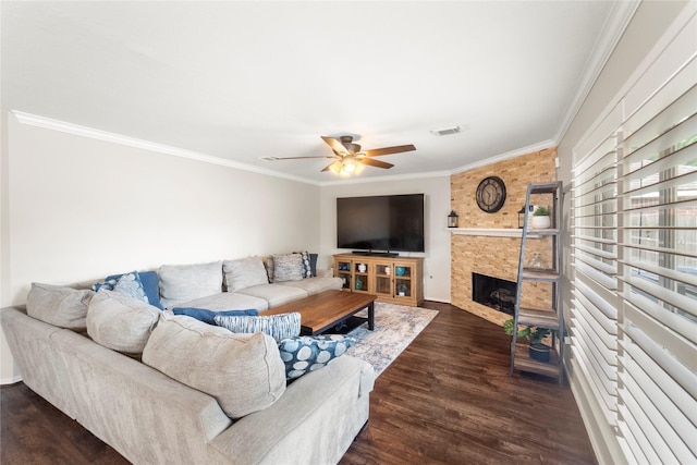 6923 Cobblestone Path, Houston, TX 77084 - living area with ornamental molding, dark wood-type flooring, ceiling fan, a fireplace, and baseboards