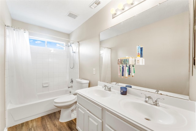 6923 Cobblestone Path, Houston, TX 77084 - full bath with wood finished floors, shower / bath combination with curtain, toilet, and double vanity