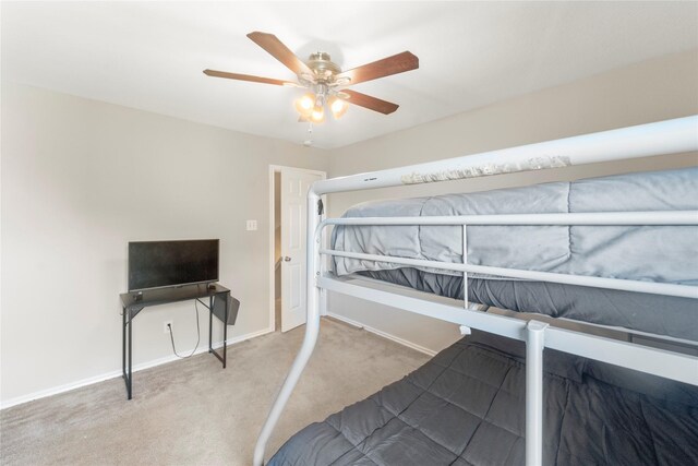 6923 Cobblestone Path, Houston, TX 77084 - unfurnished bedroom with carpet floors, baseboards, and a ceiling fan