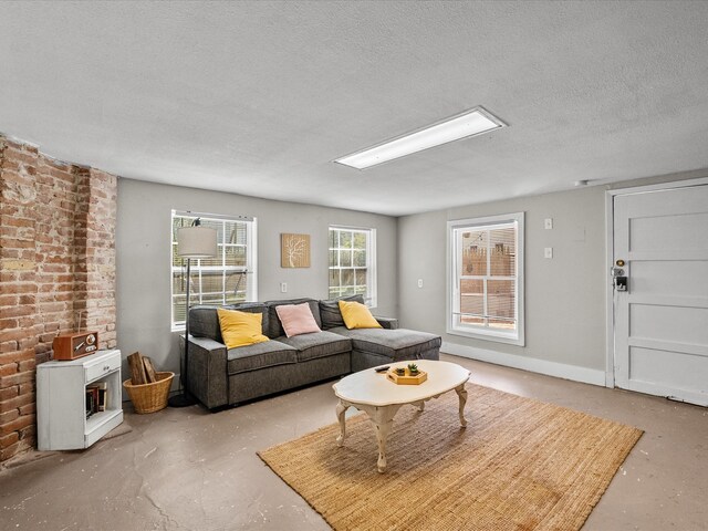 1014 20th St, Galveston, TX 77550 - living area with concrete floors and a textured ceiling