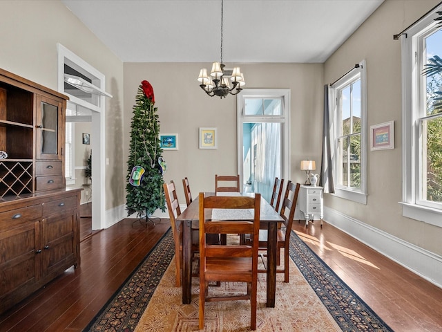 1014 20th St, Galveston, TX 77550 - dining area with light wood-style floors, a chandelier, and baseboards