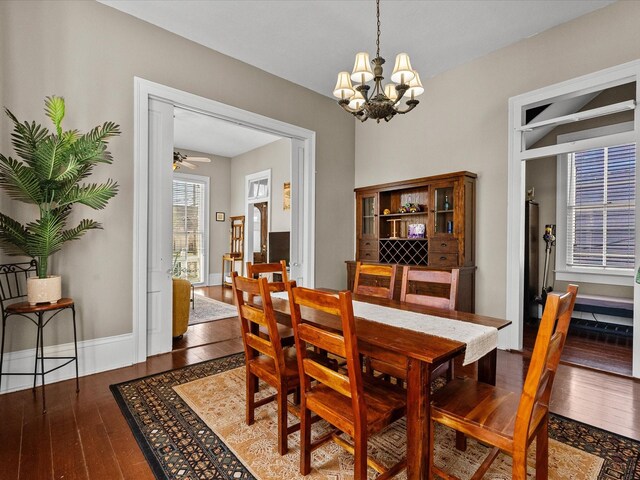 1014 20th St, Galveston, TX 77550 - dining room with a chandelier, wood-type flooring, ceiling fan, and baseboards