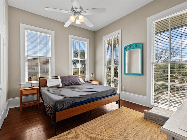 1014 20th St, Galveston, TX 77550 - bedroom featuring baseboards, hardwood / wood-style floors, and ceiling fan