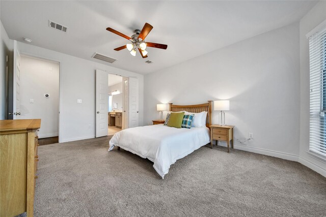 28172 Woodland Bend Way, Spring, TX 77386 - bedroom with carpet floors, baseboards, a ceiling fan, and ensuite bath