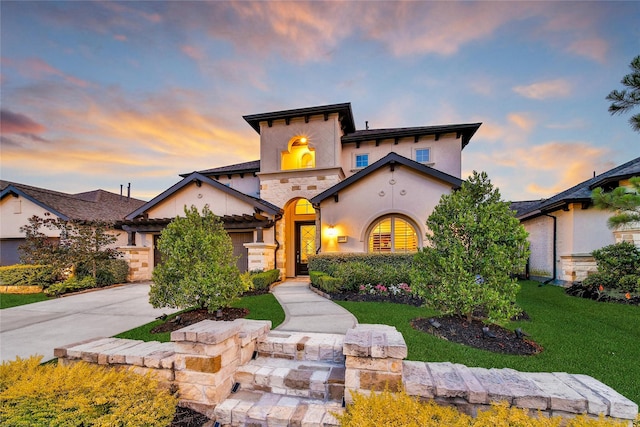28172 Woodland Bend Way, Spring, TX 77386 - view of front facade with concrete driveway, a front lawn, stucco siding, stone siding, and a garage