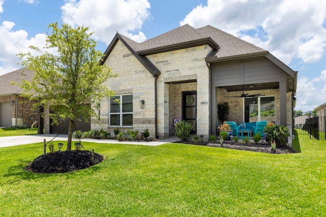 12211 Grey Plover Ct, Conroe, TX 77304 - view of front of house featuring stone siding, driveway, roof with shingles, a garage, and brick siding