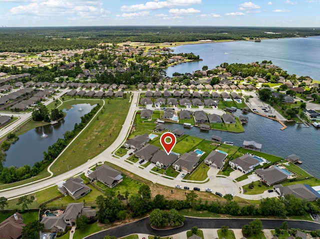 12211 Grey Plover Ct, Conroe, TX 77304 - aerial view of property and surrounding area with a large body of water and nearby suburban area