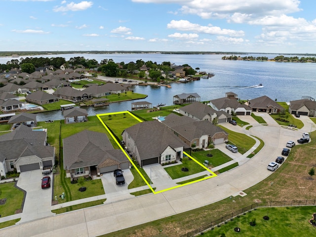12211 Grey Plover Ct, Conroe, TX 77304 - aerial view of residential area featuring property boundaries highlighted and a large body of water