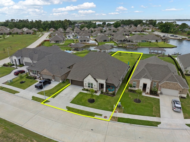 12211 Grey Plover Ct, Conroe, TX 77304 - aerial view of residential area with property boundaries highlighted and a large body of water