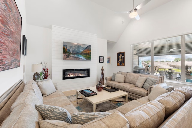 12211 Grey Plover Ct, Conroe, TX 77304 - living room with a large fireplace, high vaulted ceiling, and a ceiling fan