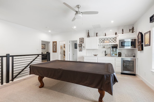 12211 Grey Plover Ct, Conroe, TX 77304 - game room with beverage cooler, attic access, bar with sink, light carpet, and ceiling fan
