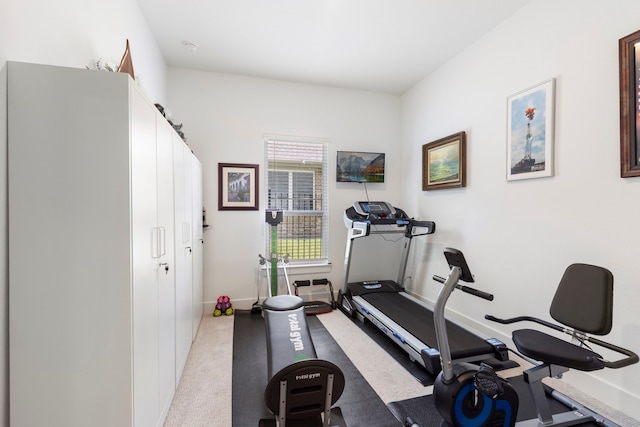 12211 Grey Plover Ct, Conroe, TX 77304 - workout area featuring baseboards and light colored carpet