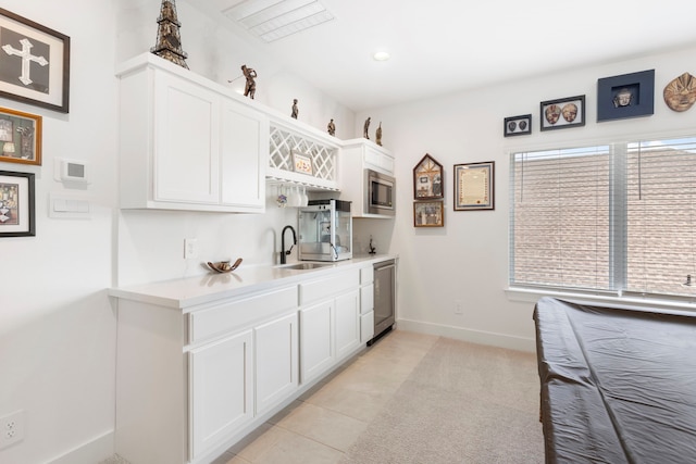 12211 Grey Plover Ct, Conroe, TX 77304 - kitchen with appliances with stainless steel finishes, plenty of natural light, white cabinets, and recessed lighting