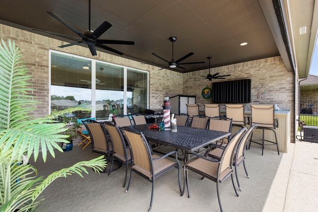 12211 Grey Plover Ct, Conroe, TX 77304 - view of patio with a ceiling fan and outdoor dining area