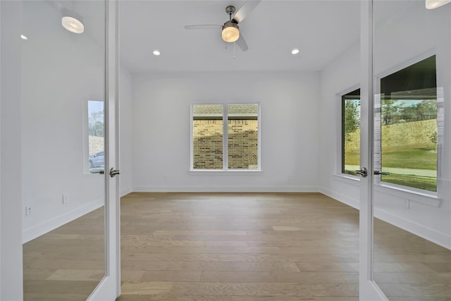 12211 Grey Plover Ct, Conroe, TX 77304 - spare room with french doors, wood finished floors, a ceiling fan, and recessed lighting