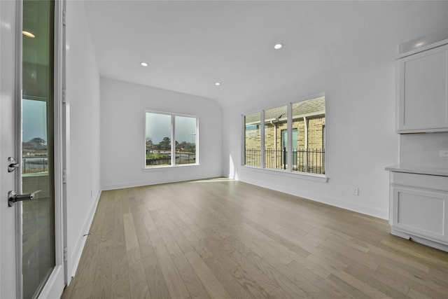 12211 Grey Plover Ct, Conroe, TX 77304 - unfurnished room with light wood-type flooring and recessed lighting