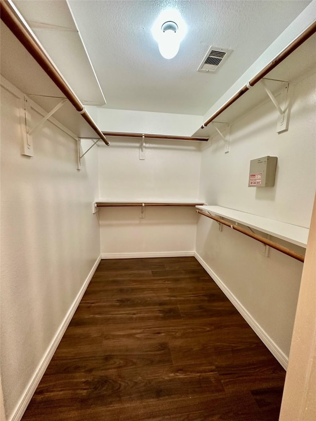 5642 Park Village Dr, Houston, TX 77048 - walk in closet with dark wood finished floors