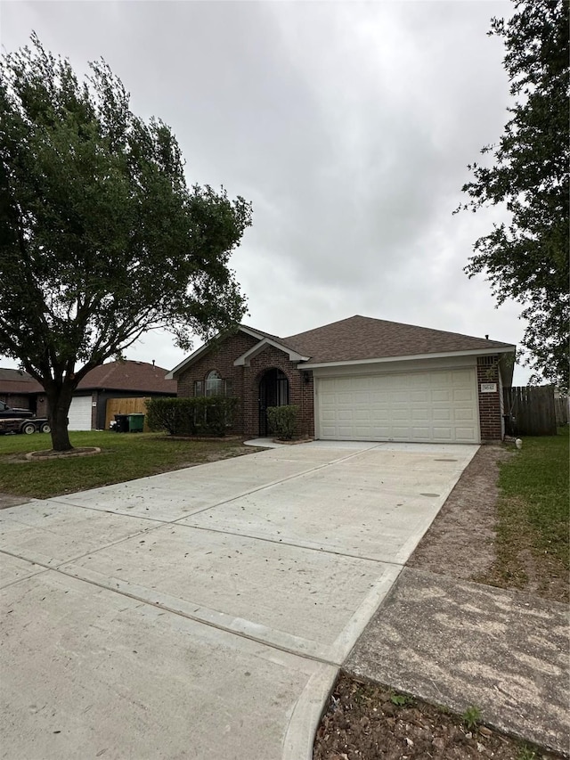 5642 Park Village Dr, Houston, TX 77048 - ranch-style house featuring brick siding, driveway, and a garage
