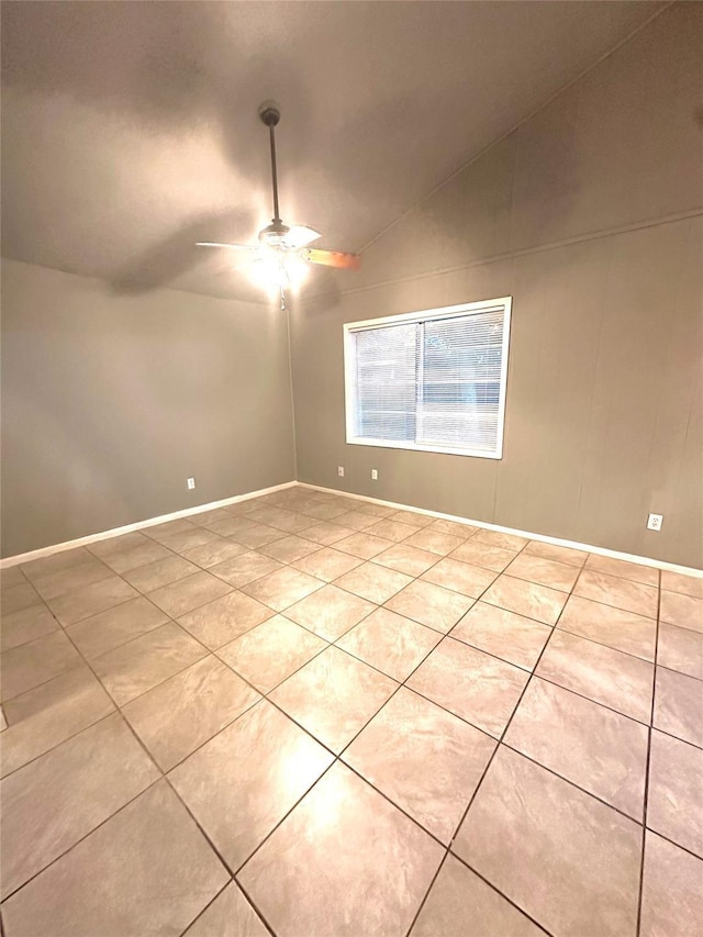 3918 Dalmatian Dr, Houston, TX 77045 - tiled empty room with lofted ceiling, a ceiling fan, and baseboards