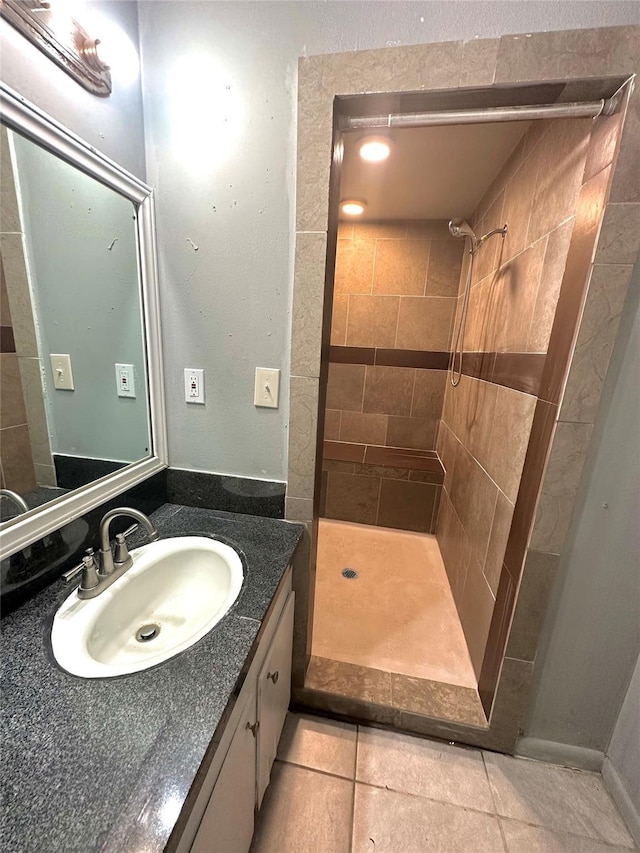 3918 Dalmatian Dr, Houston, TX 77045 - bathroom with tiled shower, vanity, and tile patterned floors