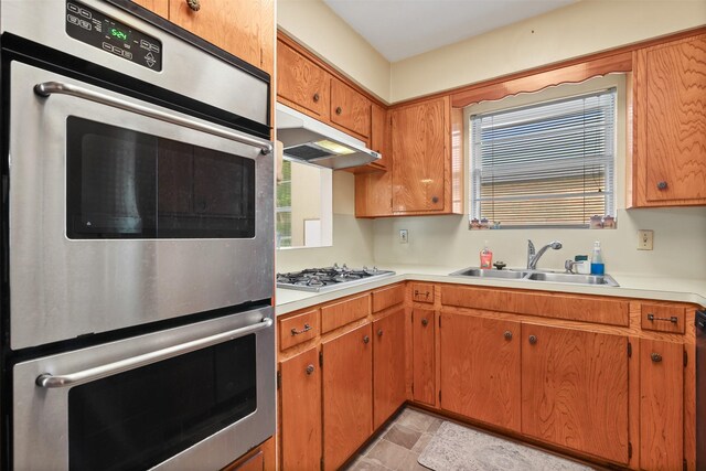 16203 White Star Dr, Houston, TX 77062 - kitchen with a sink, under cabinet range hood, light countertops, and healthy amount of natural light