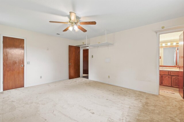 16203 White Star Dr, Houston, TX 77062 - unfurnished bedroom with light colored carpet, ensuite bath, baseboards, and a ceiling fan