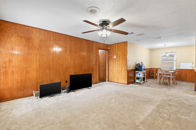 16203 White Star Dr, Houston, TX 77062 - carpeted living area featuring ceiling fan and wood walls
