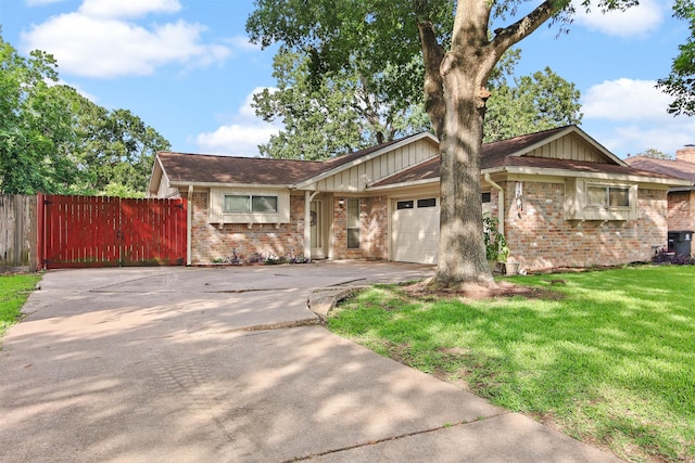 16203 White Star Dr, Houston, TX 77062 - view of front facade featuring brick siding, concrete driveway, an attached garage, and board and batten siding