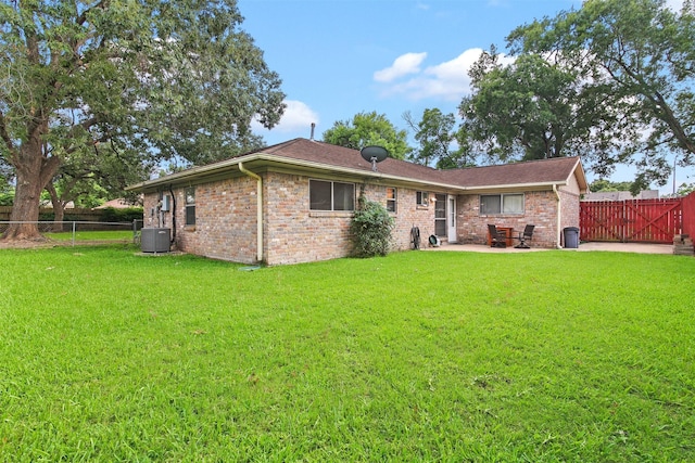 16203 White Star Dr, Houston, TX 77062 - back of house with central air condition unit, a patio, brick siding, and a gate