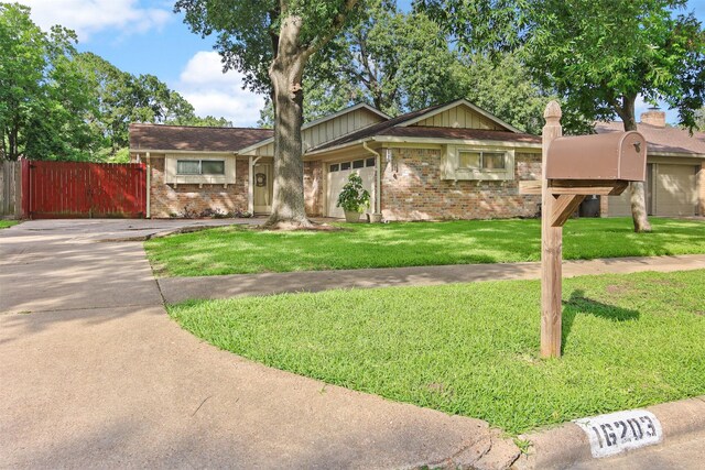 16203 White Star Dr, Houston, TX 77062 - single story home featuring brick siding, concrete driveway, and an attached garage