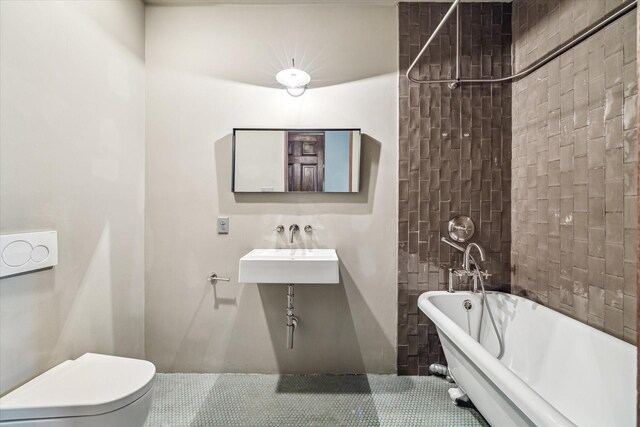 808 Coronado St, Houston, TX 77009 - full bathroom with a freestanding bath, a sink, tile patterned floors, and toilet