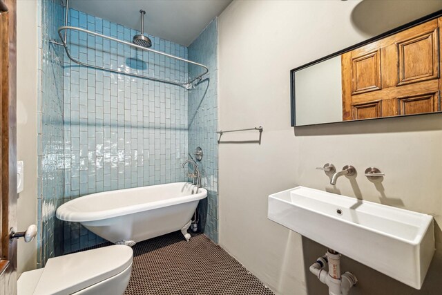 808 Coronado St, Houston, TX 77009 - bathroom featuring a sink, toilet, and tile patterned floors