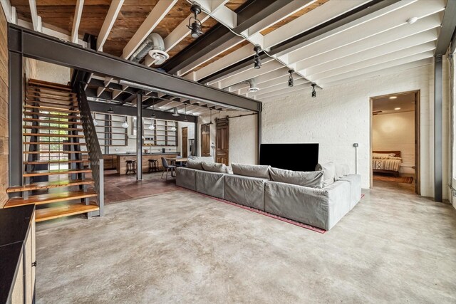 808 Coronado St, Houston, TX 77009 - living room with concrete flooring and stairs
