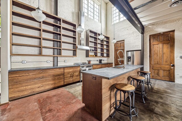 808 Coronado St, Houston, TX 77009 - kitchen featuring stainless steel appliances, a sink, brown cabinets, dark countertops, and concrete floors
