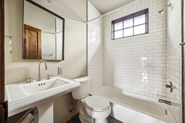 808 Coronado St, Houston, TX 77009 - bathroom featuring toilet, bathtub / shower combination, and a sink