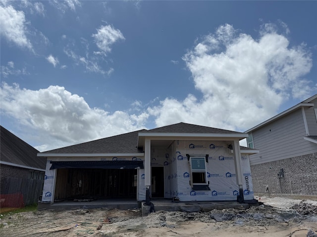 8335 Bay Oaks Dr, Baytown, TX 77523 - property in mid-construction featuring an attached garage, roof with shingles, and driveway