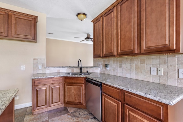 1511 Tournament Ct, Crosby, TX 77532 - kitchen with dishwasher, a sink, a ceiling fan, brown cabinetry, and backsplash