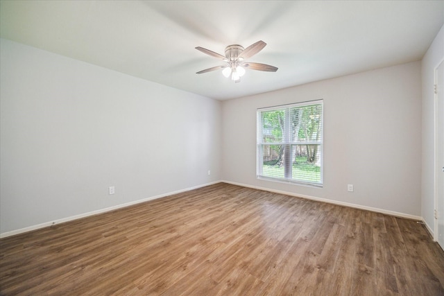 13603 Woodchester Dr, Sugar Land, TX 77498 - empty room with a ceiling fan and wood finished floors