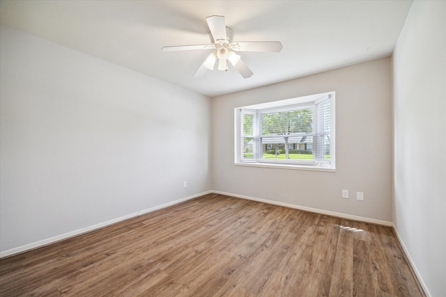 13603 Woodchester Dr, Sugar Land, TX 77498 - empty room with wood finished floors and a ceiling fan